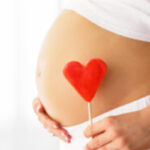 image of pregnant belly with a heart
