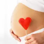 image of pregnant belly with a heart