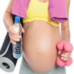 Image of women lifting weights and holding water for a fit pregnancy