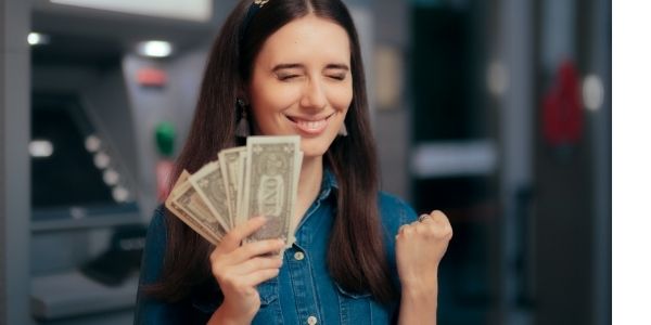 excited women holding money 