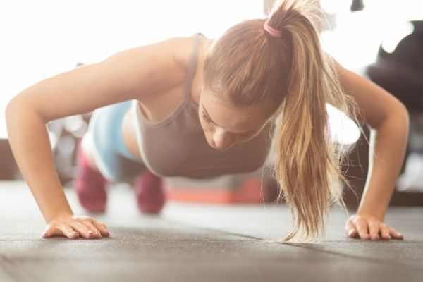 strong female doing pushups