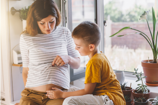 pregnant mom with son 
