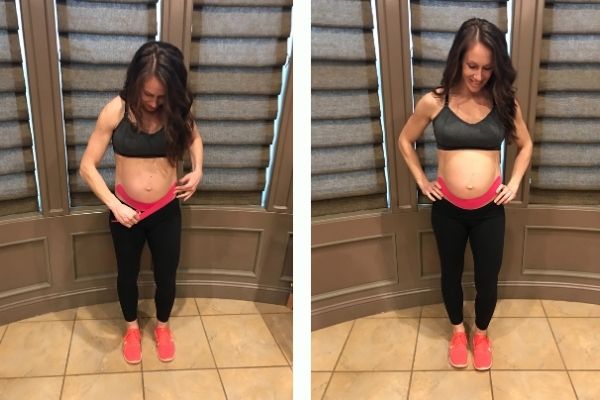 fit pregnant mom using kinesiology tape to support her belly and back pain