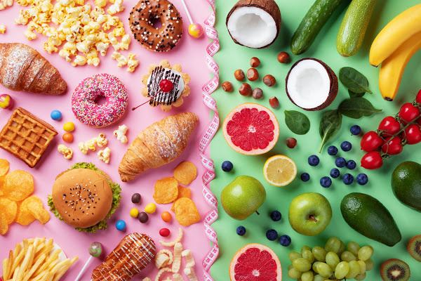 bright colored picture of healthy food on the right side with green background and unhealthy food on the left side with a bright pink background 