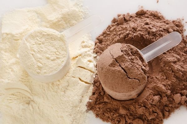 white vanilla protein powder and brown chocolate protein powder.