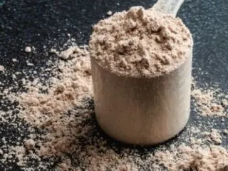 chocolate protein powder with a dark background
