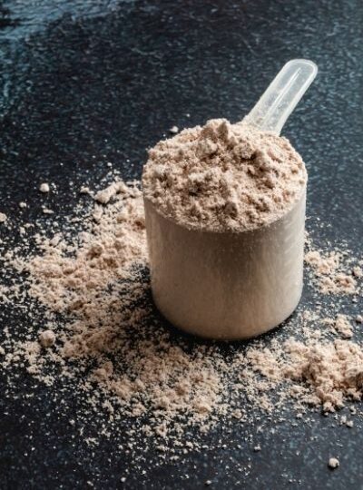 chocolate protein powder with a dark background