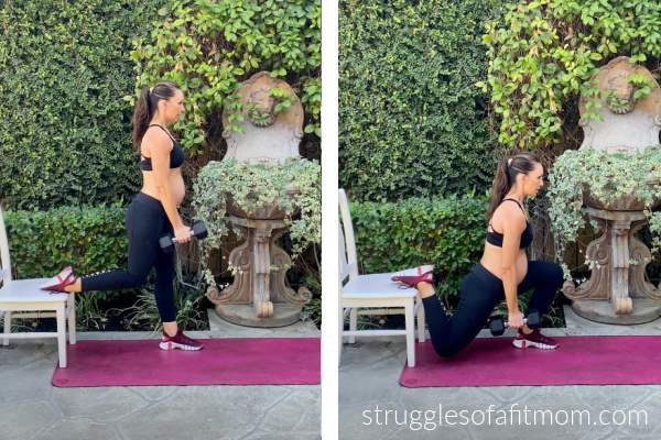 Fit pregnant mom in her third trimester doing a bulgarian split squat. She has one foot on a chair behind her and is holding a dumbbell in one hand. she is wearing black pants and a black sports bra. She is on a pink yoga mat outside.  