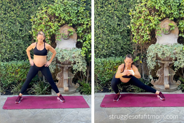 Fit pregnant mom in her third trimester doing a lateral lunge exercise during pregnancy. she is in black pants and a black sports bra on a pink yoga mat outside.  