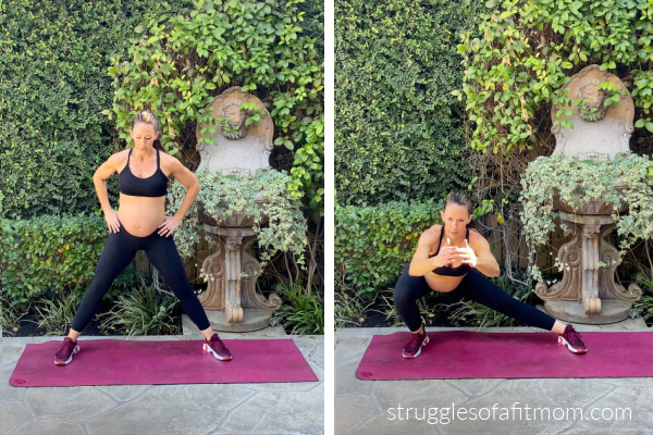 Fit pregnant mom in her third trimester doing a lateral lunge exercise during pregnancy. she is in black pants and a black sports bra on a pink yoga mat outside.