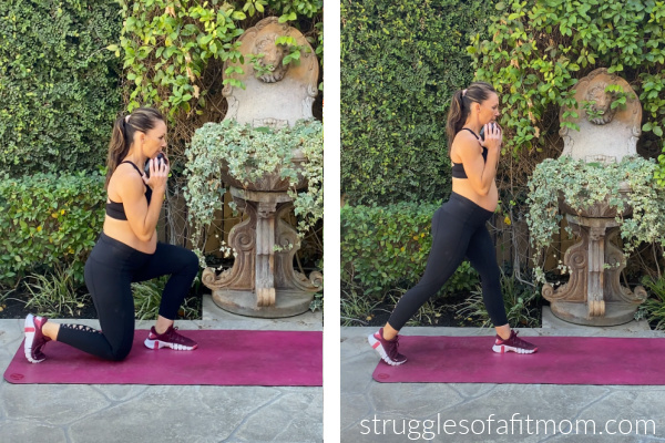 Fit pregnant mom in her third trimester doing a split squat in black pants and a black sports bra. She is on a pink yoga mat outside. She is holding a dumbbell at her chest.
